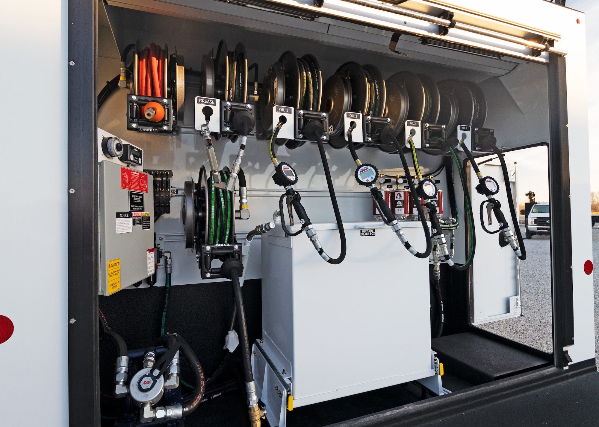 open lube truck body rear reel storage compartment