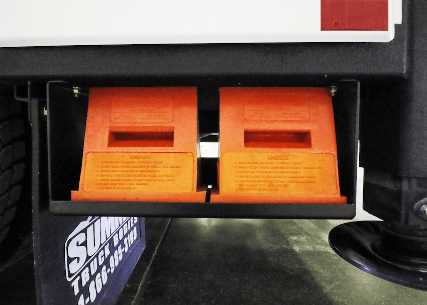 service truck tool storage ideas: Underbody mounted wheel chock block storage