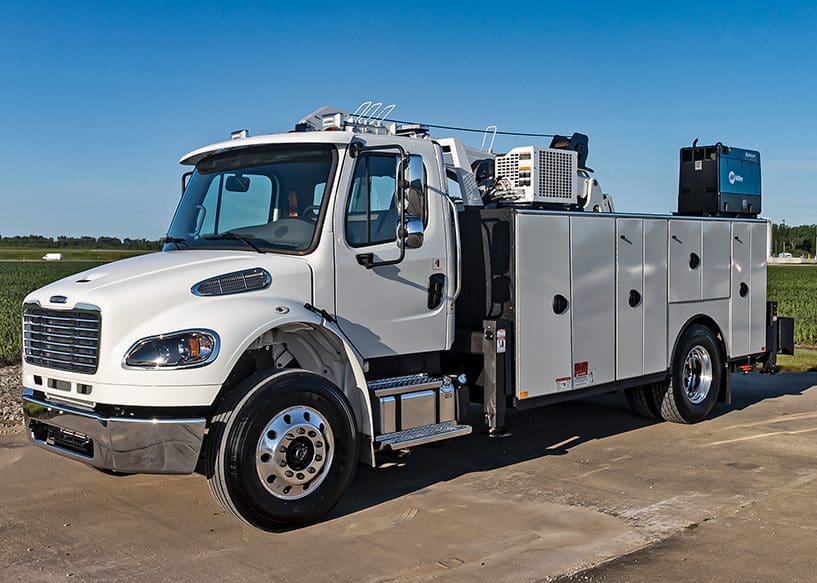 Freightliner work truck with air compressor, welder and crane.